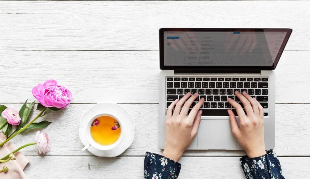 Woman typing at desk